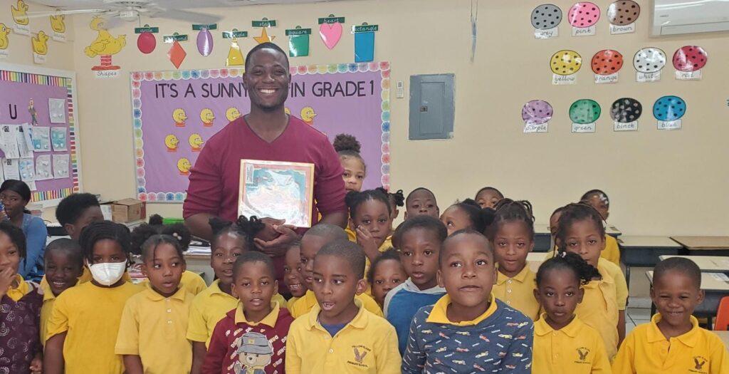 Jean Joseph pictured with students of a Yellow Elder Primary School class.